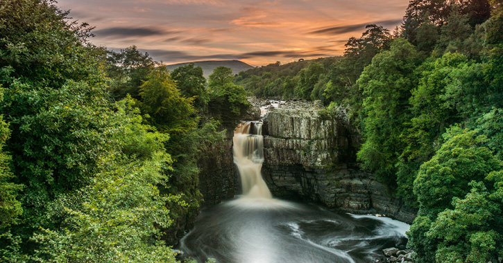View of High Force Waterfall at sunset